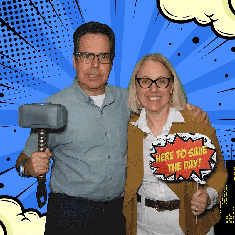 Couple with comic-book props at the GIF booth