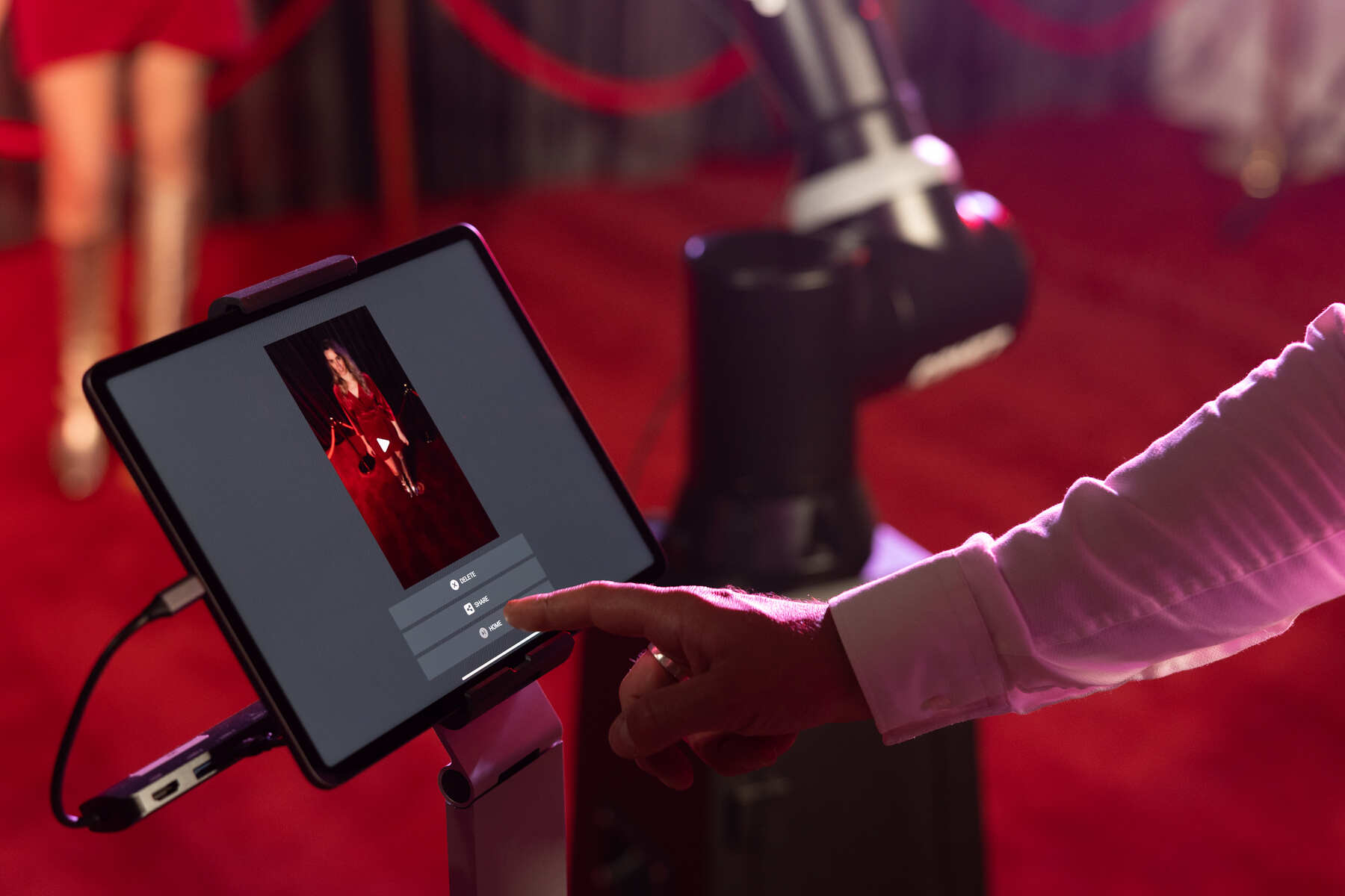 Glambot robotic arm set up on a red carpet at an NYC venue — photo 1