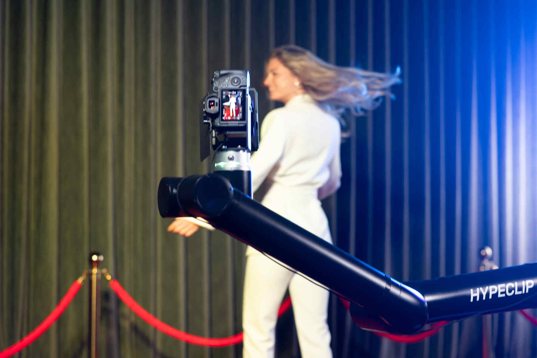 Guest posing for a slow-motion Glambot clip at a New York event — photo 2