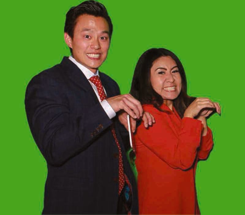 Guests posing in front of the green screen before compositing
