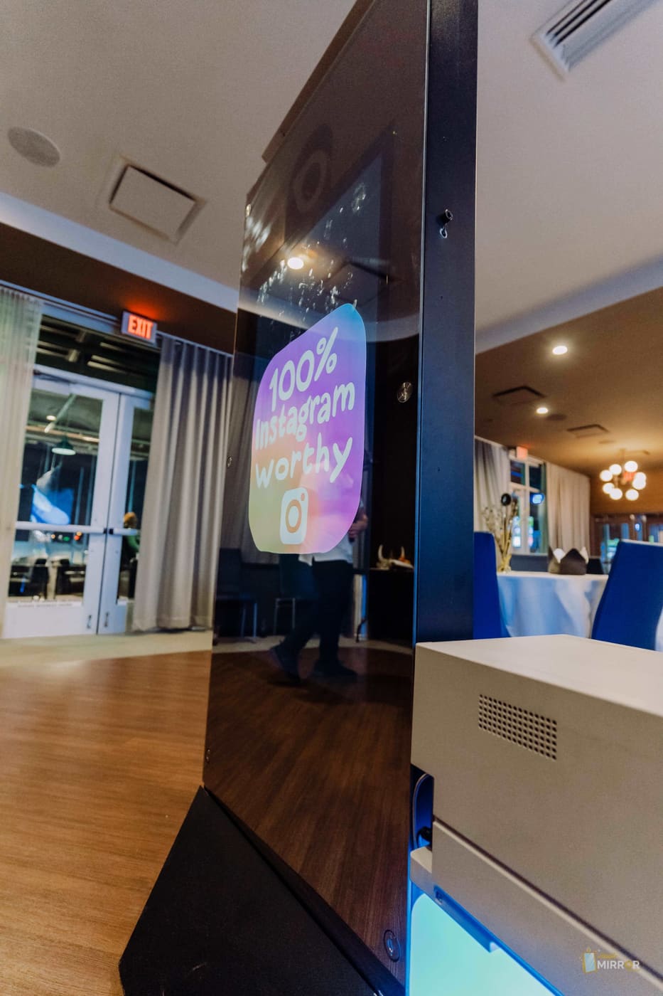 Mirror X photo booth — sleek frameless mirror with animated welcome screen