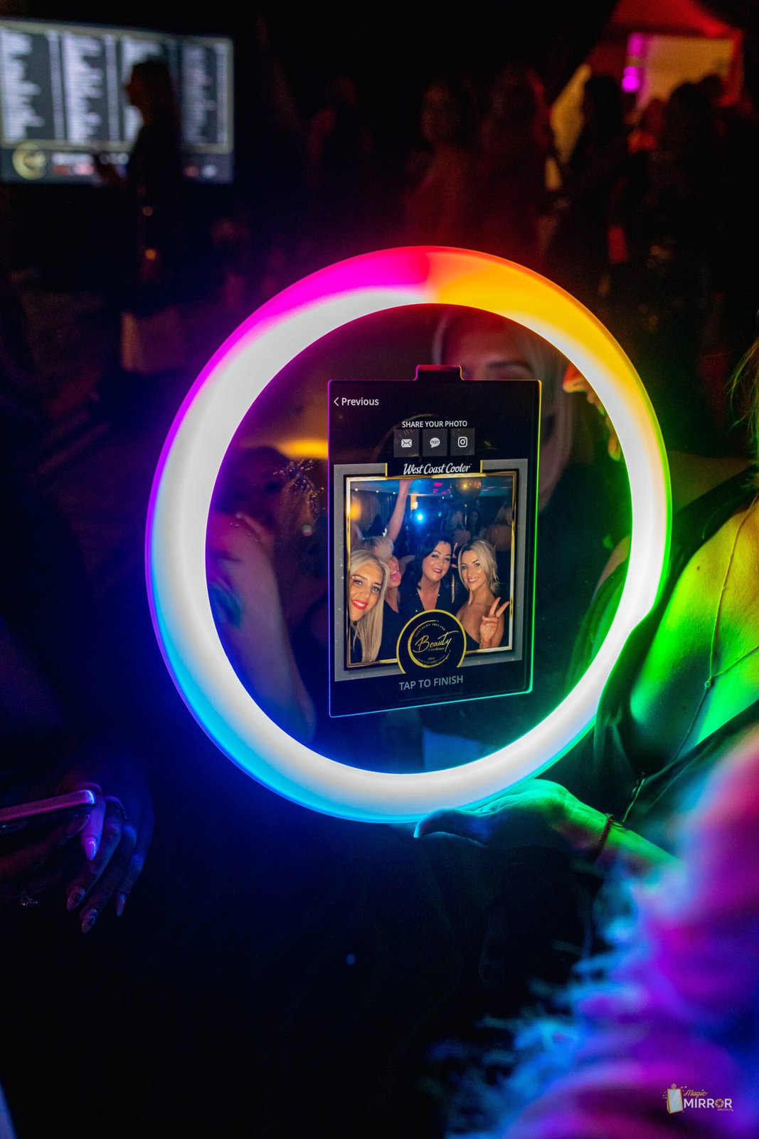 Guests taking a ring-light selfie with the roaming booth