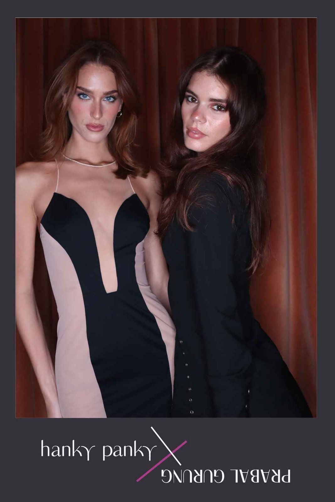 Studio booth portrait of two guests against a curtain backdrop