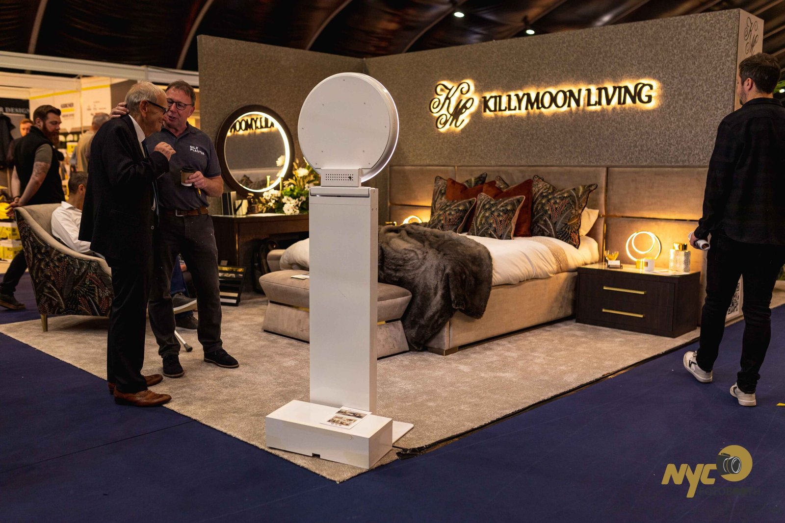 Selfie booth kiosk at a furniture brand exhibition stand