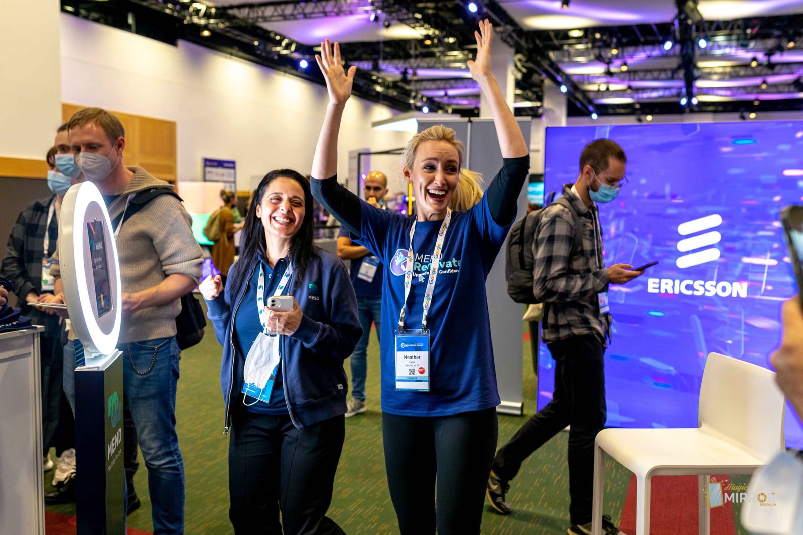 Attendees celebrating at a conference photo booth activation