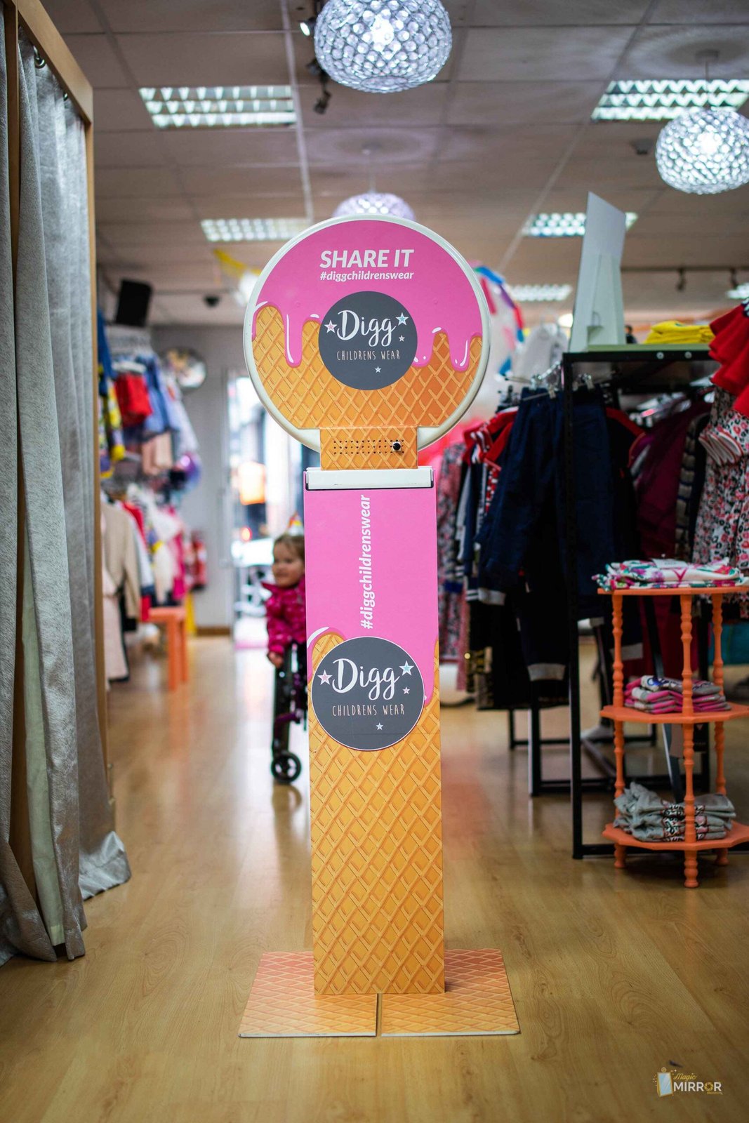 Ice-cream themed branded kiosk at a childrenswear retail activation