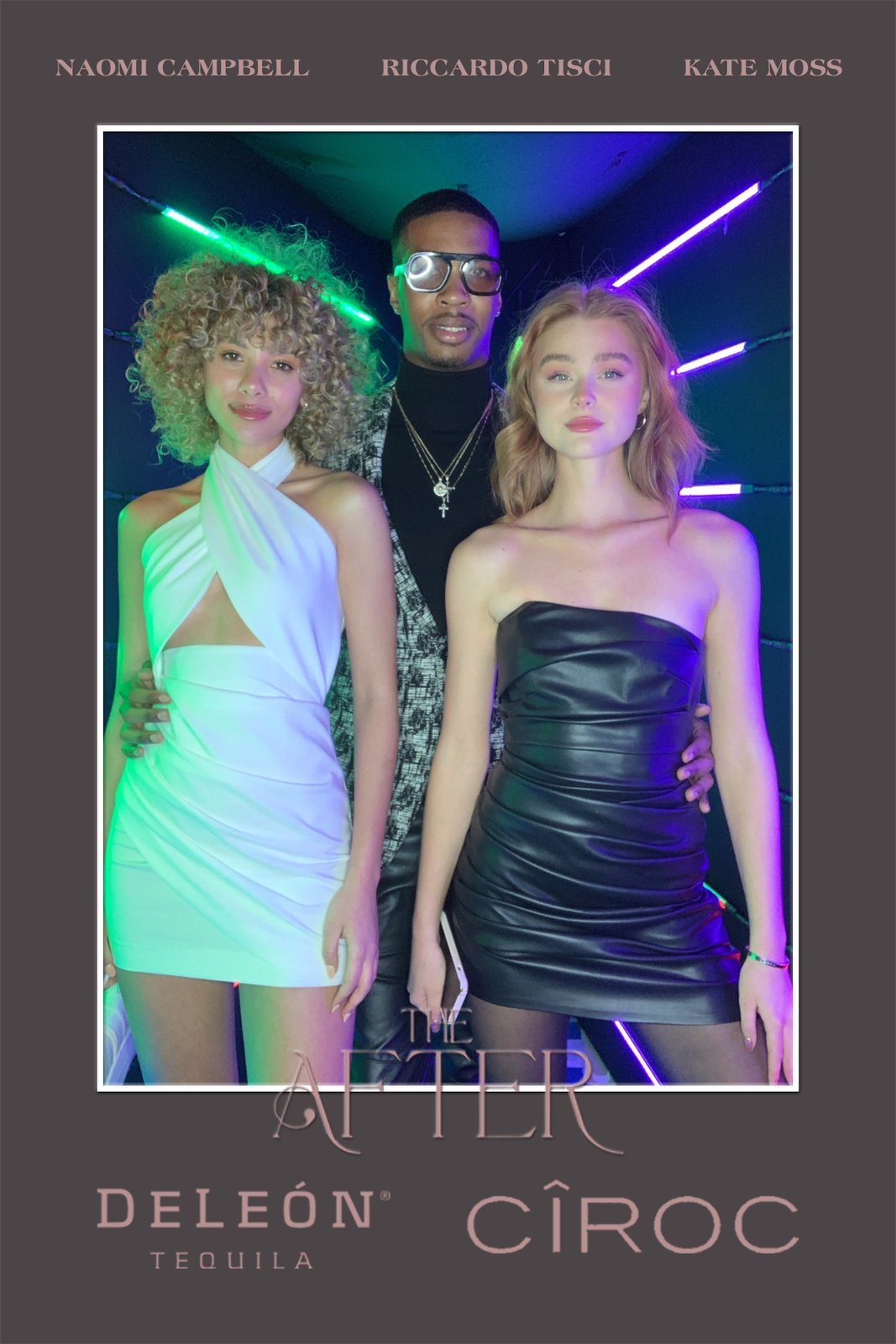 Friends posing in the vogue booth at a night event