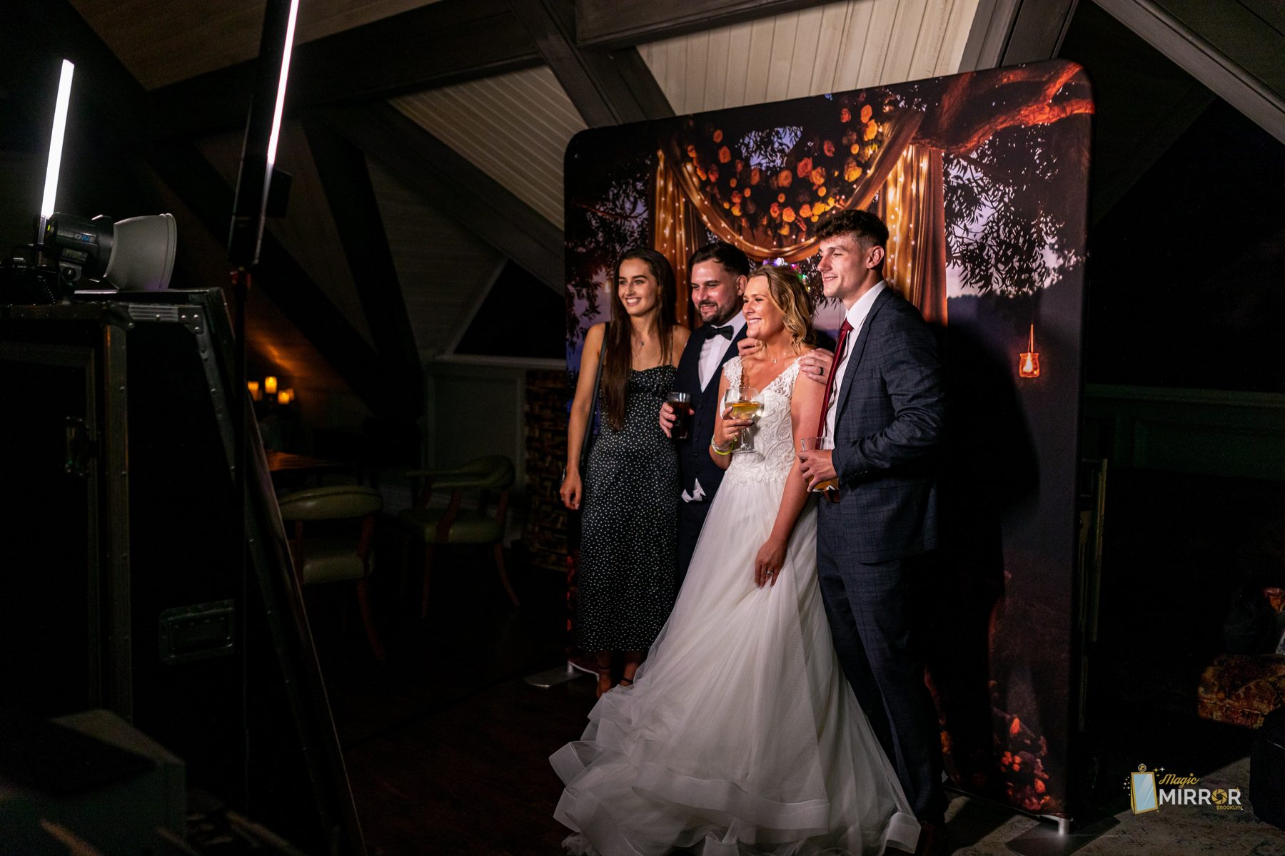 Bride and groom posing at the wedding photo booth in New York City